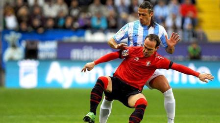 Imágenes del encuentro entre Osasuna y Málaga, disputado este domingo en el estadio de la Rosaleda.
