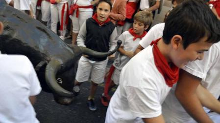 Imágenes del encierro txiki del día 13 de San Fermín