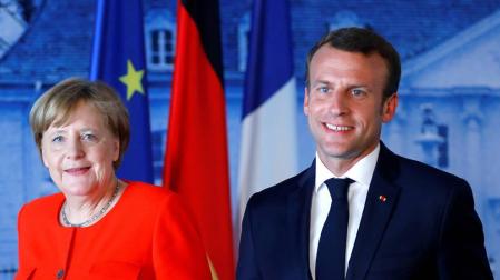 Merkel y Macron abren la puerta a acuerdos migratorios entre países de la UE