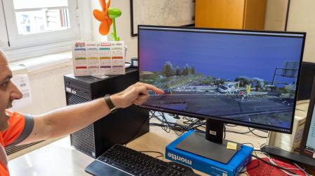 Pablo Esquisabel Otamendi y Merche Aldave Larequi, de la unidad de Atestados de la Policía Foral, junto al escáner Leica de reconstrucción de escenarios en la comisaría de Beloso