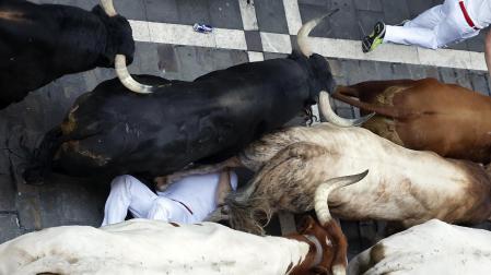 Fotos del cuarto encierro de San Fermín 2025 en Pamplona.