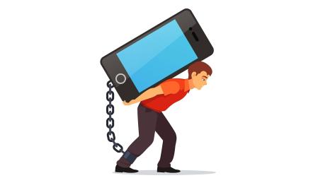 Bended man carrying on his back big and heavy mobile phone chained with shackles to his leg. Modern technology burden concept. Flat style vector illustration isolated on white background.