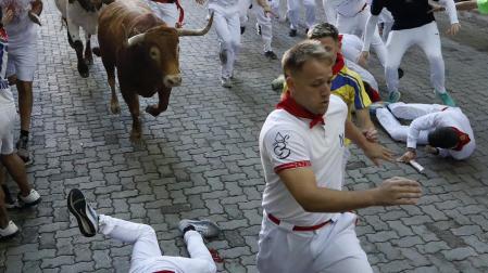 Fotos del tercer encierro de San Fermín 2025 en Pamplona.