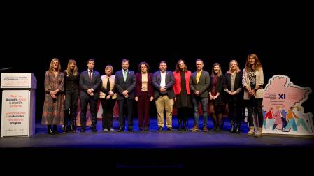 Autoridades y representantes de las distintas familias de la Economía Social, este martes en el escenario de la Escuela Navarra de Teatro
