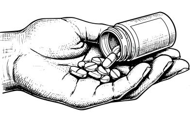 Una persona coge pastillas de un bote de medicamentos