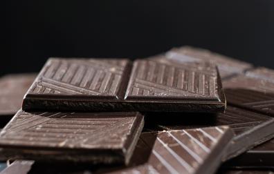 Delicious dark chocolate segments, rich black chocolate texture.