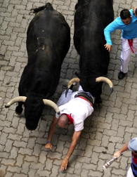 Imágenes del encierro del 12 de julio, con toros de Victoriano del Río