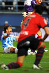 Imágenes del encuentro entre Osasuna y Málaga, disputado este domingo en el estadio de la Rosaleda.
