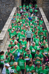 Fotos de la novena marcha solidaria contra el cáncer en Pamplona./