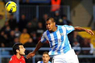 Imágenes del encuentro entre Osasuna y Málaga, disputado este domingo en el estadio de la Rosaleda.