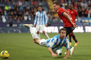 Imágenes del encuentro entre Osasuna y Málaga, disputado este domingo en el estadio de la Rosaleda.