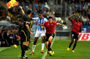 Imágenes del encuentro entre Osasuna y Málaga, disputado este domingo en el estadio de la Rosaleda.