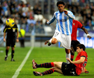 Imágenes del encuentro entre Osasuna y Málaga, disputado este domingo en el estadio de la Rosaleda.