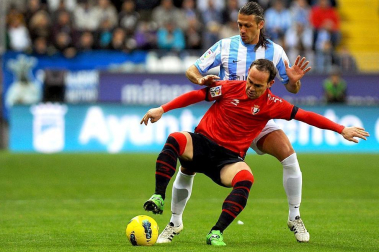 Imágenes del encuentro entre Osasuna y Málaga, disputado este domingo en el estadio de la Rosaleda.