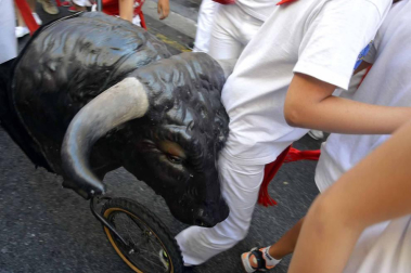 Imágenes del encierro txiki del día 13 de San Fermín