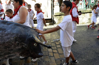 Imágenes del encierro txiki del día 13 de San Fermín