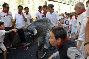 Imágenes del encierro txiki del día 13 de San Fermín