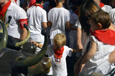 Imágenes del encierro txiki del día 13 de San Fermín