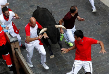 Imágenes del séptimo encierro de los Sanfermines de 2018, con toros de la ganadería Jandilla.