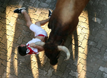 Imágenes del octavo encierro de los Sanfermines de 2018, con toros de la ganadería Miura.