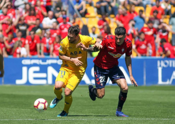 Galería de imágenes del partido disputado este sábado en el estadio de Santo Domingo.