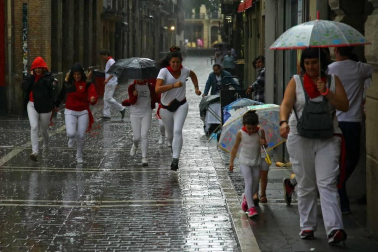 Fotos de Pamplona pasada por agua en el tercer día de Sanfermines
