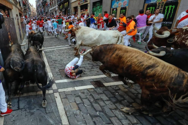 Imágenes del séptimo encierro de los Sanfermines 2019 protagonizado por toros de La Palmosilla.