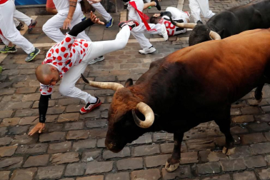 Imágenes del séptimo encierro de los Sanfermines 2019 protagonizado por toros de La Palmosilla.