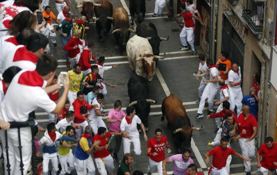 Imágenes del séptimo encierro de los Sanfermines 2019 protagonizado por toros de La Palmosilla.
