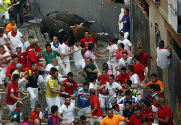 Imágenes del séptimo encierro de los Sanfermines 2019 protagonizado por toros de La Palmosilla.