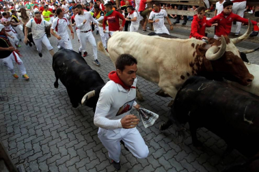 Imágenes del séptimo encierro de los Sanfermines 2019 protagonizado por toros de La Palmosilla.
