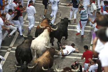 Imágenes del séptimo encierro de los Sanfermines 2019 protagonizado por toros de La Palmosilla.