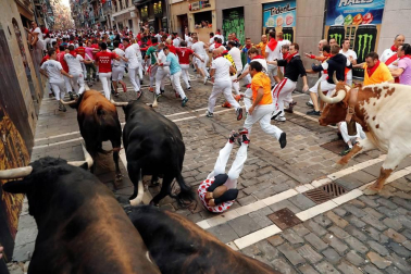 Imágenes del séptimo encierro de los Sanfermines 2019 protagonizado por toros de La Palmosilla.