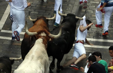 Fotos de los mejores momentos de los encierros de San Fermín 2019
