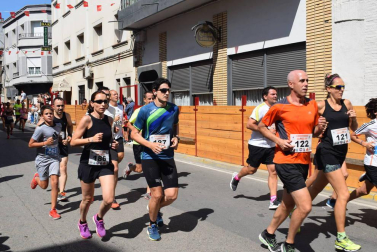 Participantes en la carrera popular disputada este domingo 11 de agosto.,