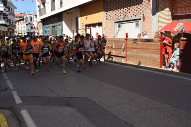 Participantes en la carrera popular disputada este domingo 11 de agosto.,