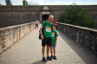 Fotos de la novena marcha solidaria contra el cáncer en Pamplona./