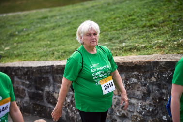 Fotos de la novena marcha solidaria contra el cáncer en Pamplona./