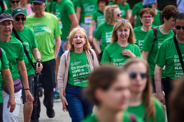Fotos de la novena marcha solidaria contra el cáncer en Pamplona./