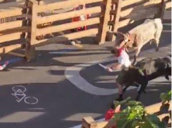 A northamerican marine runs over the Running of the Bulls in Tudela