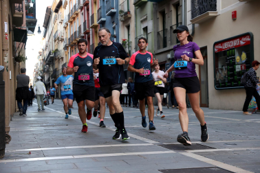 Fotos de la Tres Burgos Tres Millas celebrada este viernes en Pamplona.