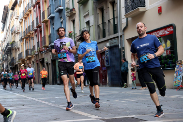 Fotos de la Tres Burgos Tres Millas celebrada este viernes en Pamplona.