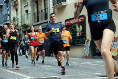 Fotos de la Tres Burgos Tres Millas celebrada este viernes en Pamplona.