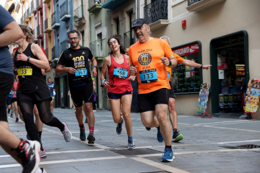 Fotos de la Tres Burgos Tres Millas celebrada este viernes en Pamplona.