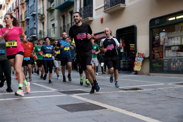 Fotos de la Tres Burgos Tres Millas celebrada este viernes en Pamplona.