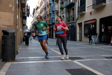 Fotos de la Tres Burgos Tres Millas celebrada este viernes en Pamplona.