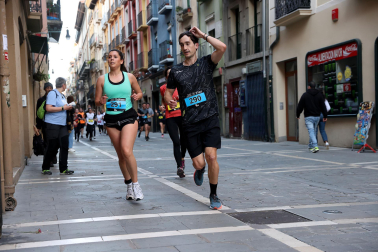 Fotos de la Tres Burgos Tres Millas celebrada este viernes en Pamplona.