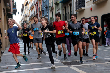 Fotos de la Tres Burgos Tres Millas celebrada este viernes en Pamplona.