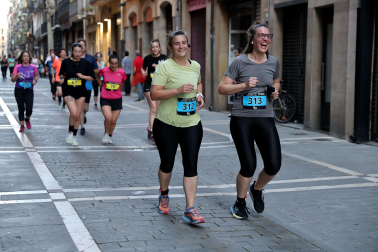 Fotos de la Tres Burgos Tres Millas celebrada este viernes en Pamplona.