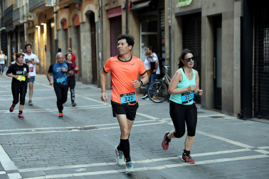 Fotos de la Tres Burgos Tres Millas celebrada este viernes en Pamplona.